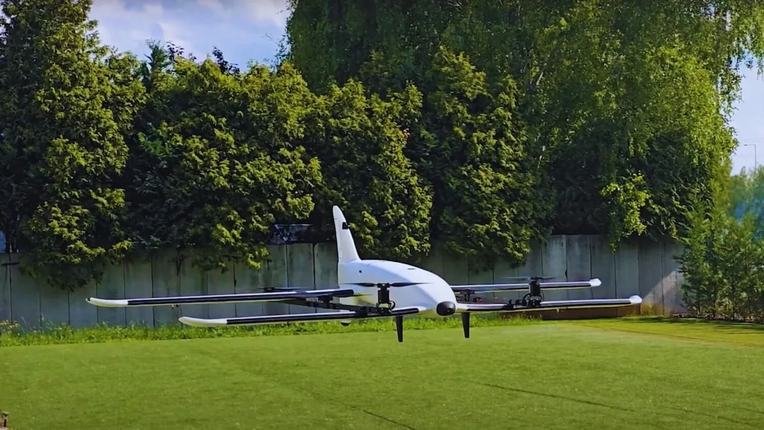 ARACE Phoenix electric tiltrotor VTOL flying above a field